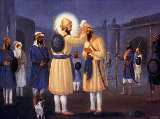 Guru Gobind Singh dressing a Sikh with his own clothing